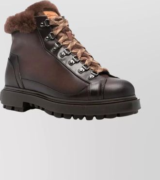 Santoni ankle boots with fur trim and metal eyelets