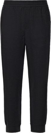 Emporio Armani Joggers de punto interlock mezcla de lyocell con letras en jacquard - Trousers - Hombre - Negro - XL