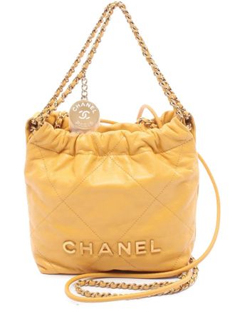 Chanel 2021-2025 22 mini-handtas van glanzend kalfsleer - Geel