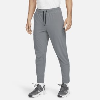 Nike Mens Unlimited Dri-FIT Zippered Cuff Versatile Pants in Grey | FB7548-084