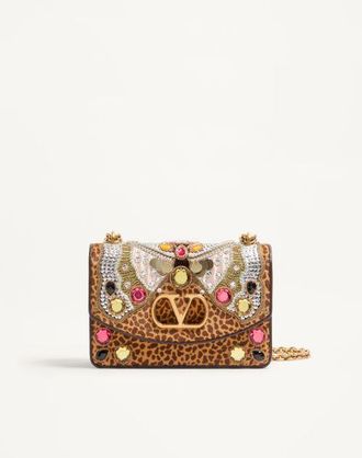 Valentino Garavani Valentino Garavani Vain embroidered shoulder bag in pony-effect calfskin. Wo