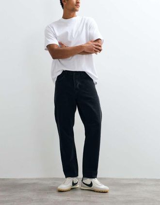 Carhartt Work in Progress jeans Newel relaxed tapered fit lavaggio nero