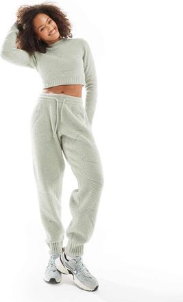 Nike Phoenix - Joggers a vita alta verde chiaro bouclé con stampa del logo