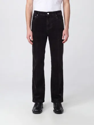 Amiri Jeans flare Flock in denim stretch con effetto usurato a vita media