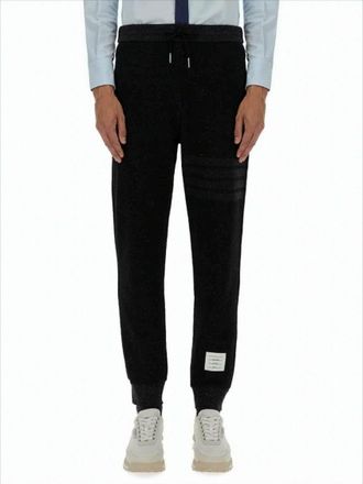 Thom Browne Tapered Jogger Pants With Ribbed Cuffs And Subtle Stripes
