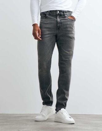Calvin Klein Jeans jeans slim tapered lavaggio chiaro grigio