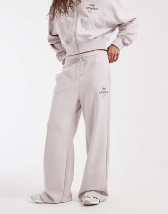 Nike Phoenix - Joggers ampi lilla in felpa a vita alta-Viola