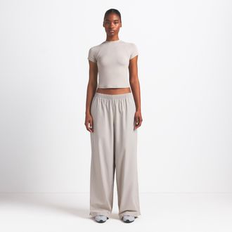 Nike Womens SKIMS Woven Nylon Oversized Track Pants in Brown | BOTRK4883-STO