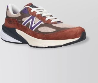 New Balance low top sneakers with mesh panels and suede overlays