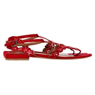 Alaia Flower Lasercut Ankle Strap Flat Sandals in Red Suede