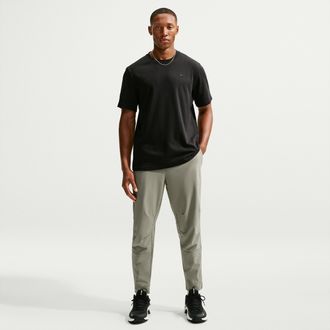 Nike Mens Unlimited Dri-FIT Zippered Cuff Versatile Pants in Green | FB7548-320