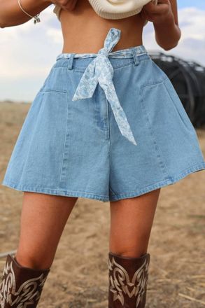 Merci Savannah High-Rise Flounce Denim Shorts With Floral Sash In Blue