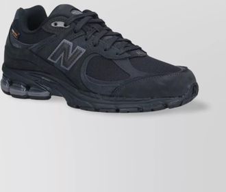 New Balance low top sneakers with mesh upper and rubber outsole