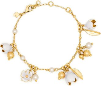 Kate Spade New York golden bloom flower charm bracelet in White. at Nordstrom