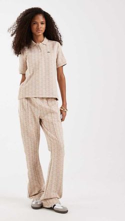 Lacoste Pantaloni sportivi a zampa rosa in coordinato