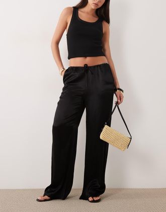 SNDYS Pantaloni a fondo ampio in raso neri con coulisse-Nero