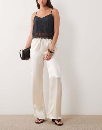 SNDYS Pantaloni a fondo ampio in raso color crema con coulisse-Bianco