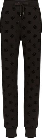 Dolce & Gabbana logo-flocked cotton track pants - women - Cotton - 42 - Black