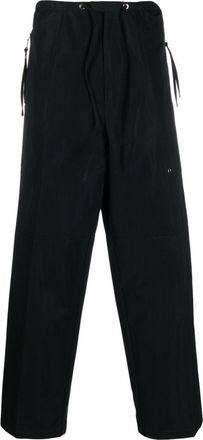 Fendi logo-patch wide-leg trousers - men - Cotton/Polyamide - 52 - Black