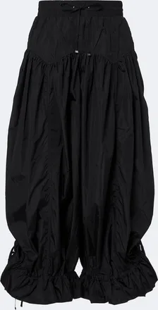 Ganni Pantalones globo con volantes