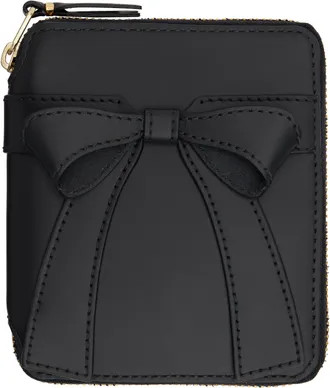 Comme Des Garçons Huge Logo Wallet Accessories from $203.00 Comme Des Garçons Huge Logo Wallet Accessories from $203.00