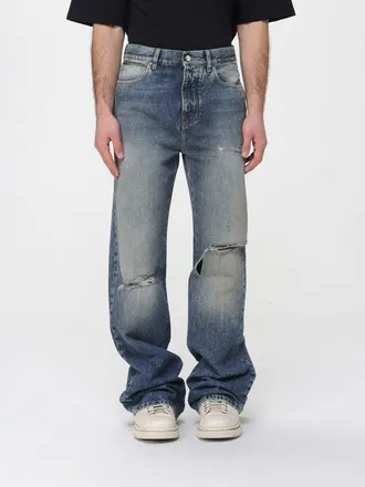 Amiri Jeans a gamba larga Amiri in denim distressed