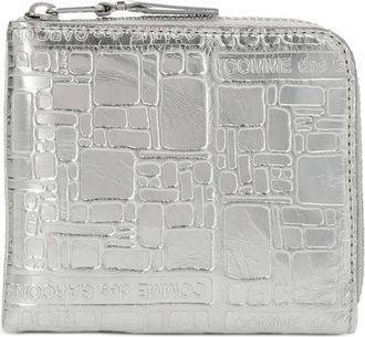 Comme Des Garçons logo-embossed leather wallet - Effetto metallizzato