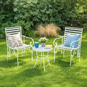 Melody Maison Ornate Metal White Round Garden Table & Set Of 2 Ornate Garden Chairs