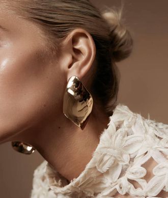 Shashi Twisted Statement Earrings In Gold
