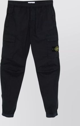 Stone Island cargo pants with snap button pockets
