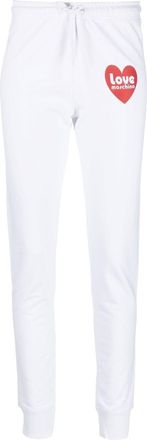 Love Moschino logo-print track trousers - women - Cotton/Spandex/Elastane - 46 - White