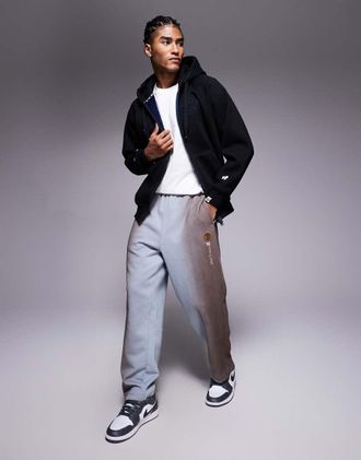 Aape By A Bathing Ape Aape By A Bathing Ape - Joggers larghi color blu slavato con ricamo sulla gamba