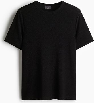 H&M Glitzerndes T-Shirt in Regular Fit - Schwarz
