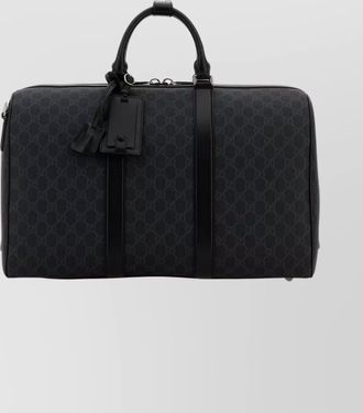 Gucci supreme fabric travel bag featuring handles