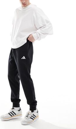 adidas adidas - Essentials Feel Cozy - Pantaloni neri e bianchi in spugna-Nero