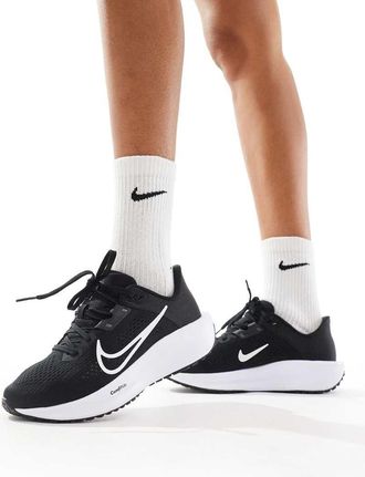 Nike Quest 6 sneakers in black and white