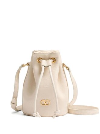 Valentino Garavani mini VLogo Signature bucket bag - women - Calf Leather - One Size - Neutrals
