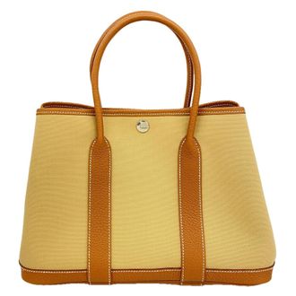 Herm&egrave;s Gold Toile Officier Tote Bag (Pre-Owned)