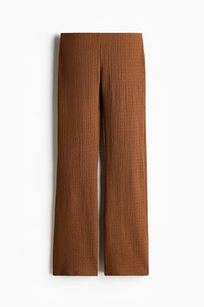 H&M Ausgestellte Hose aus Crinkle-Jersey - Beige