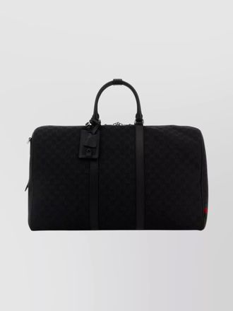 Gucci travel bag with embossed design and tag