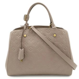 Louis Vuitton Pre-owned Montaigne Monogram Empreinte Handtas - Dames - Pre-owned - Beige - Maat: ONE Size Leer