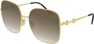 Gucci Goud/Bruin Getinte Zonnebril - Dames - Zonnebrillen - Geel - 61 MM - Accessoires