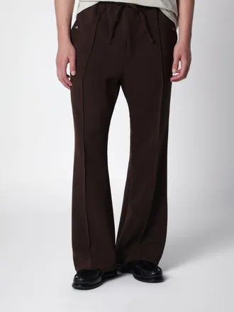 Needles Pantaloni flared in tessuto tecnico stretch con vita elasticizzata
