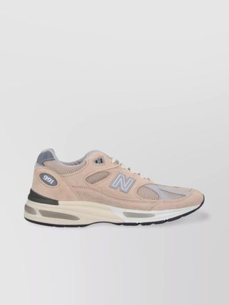 New Balance low top sneakers with mesh panels and rubber outsole