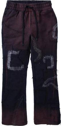 Who Decides War by Ev Bravado patchwork track pants - men - Cotton - 30 - Black