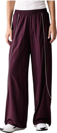 Under Armour Unstoppable Woven Wind Pants - Dames - Trainingsbroeken - Bruin - XL - Polyester - Fitness