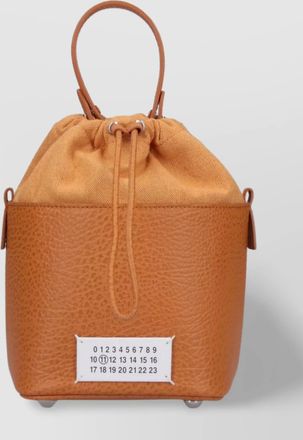 Maison Margiela leather bucket bag with adjustable strap and metal chain detail