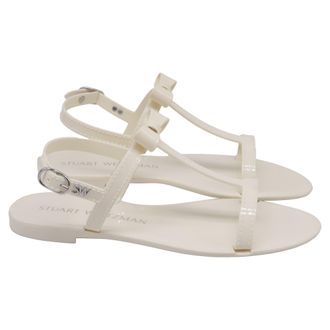 Stuart Weitzman Mellie Bow Jelly Flat Sandals In White Rubber