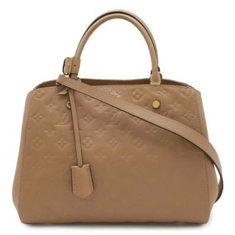 Louis Vuitton Pre-owned Monogram Empreinte Montaigne MM Handbag - Dames - Pre-owned - Bruin - Maat: ONE Size Leer