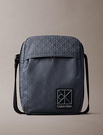 Calvin Klein Reportertas jacquard met logo en all-over embleem